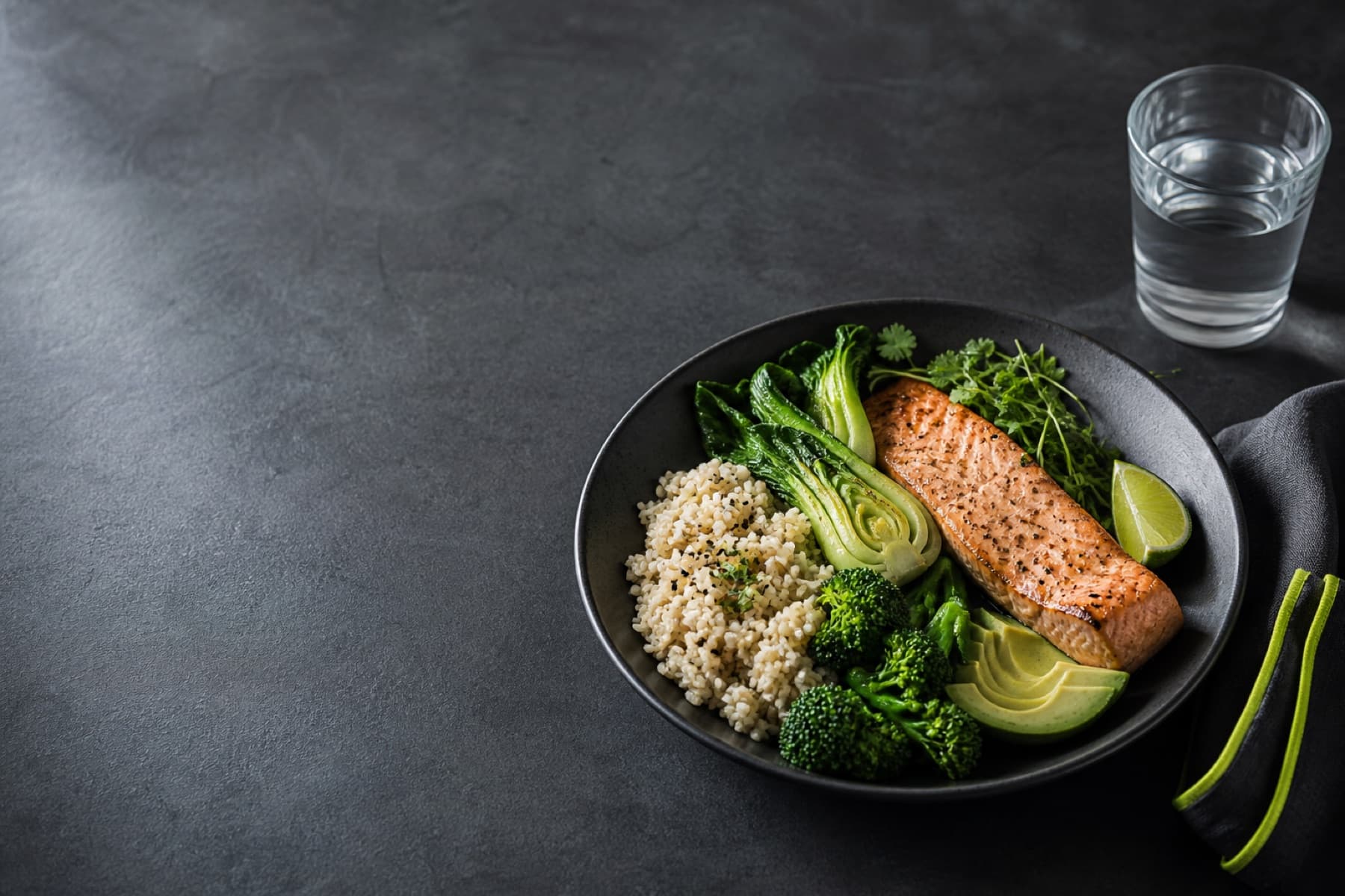 A balanced salmon, rice, avocado, and greens performance meal